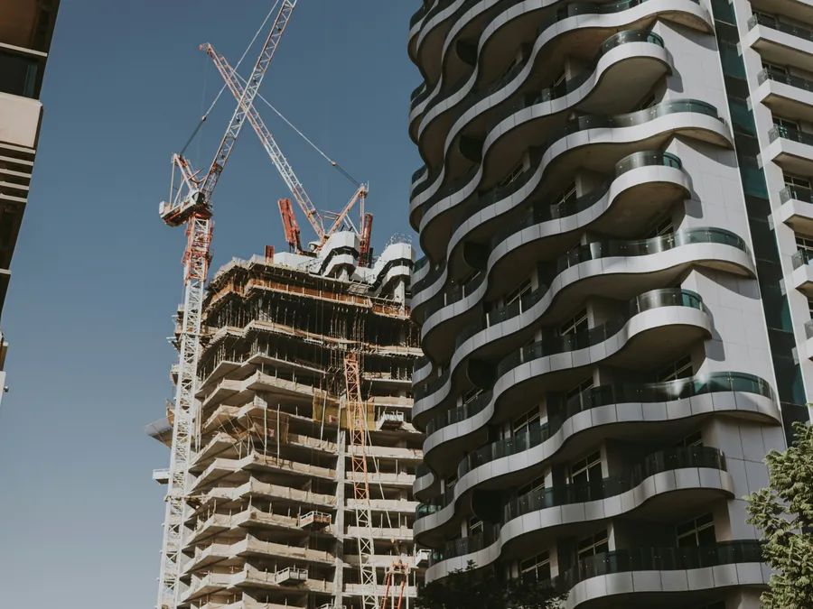Tower cranes over a building under construction