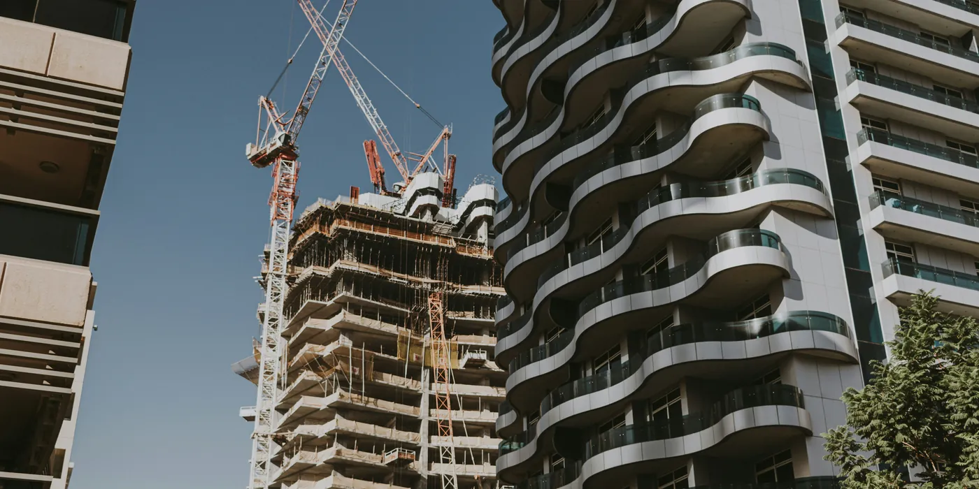 Tower cranes over a building under construction